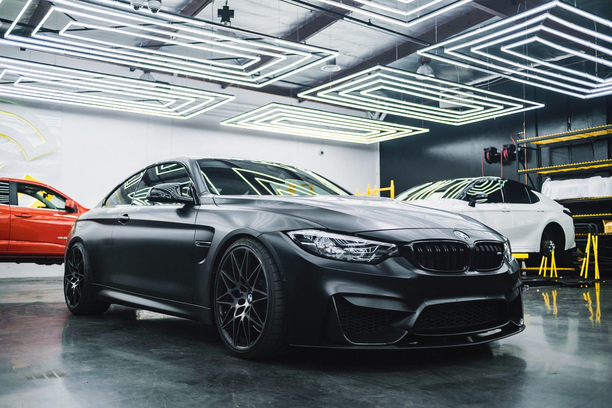 A BMW car in a garage following a BMW MOT test with Autobahn